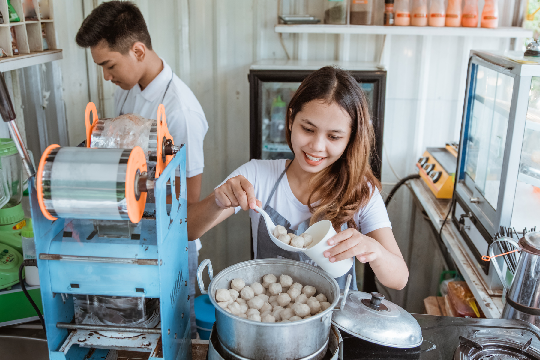Portrait Young Man and Woman Selling Meatball